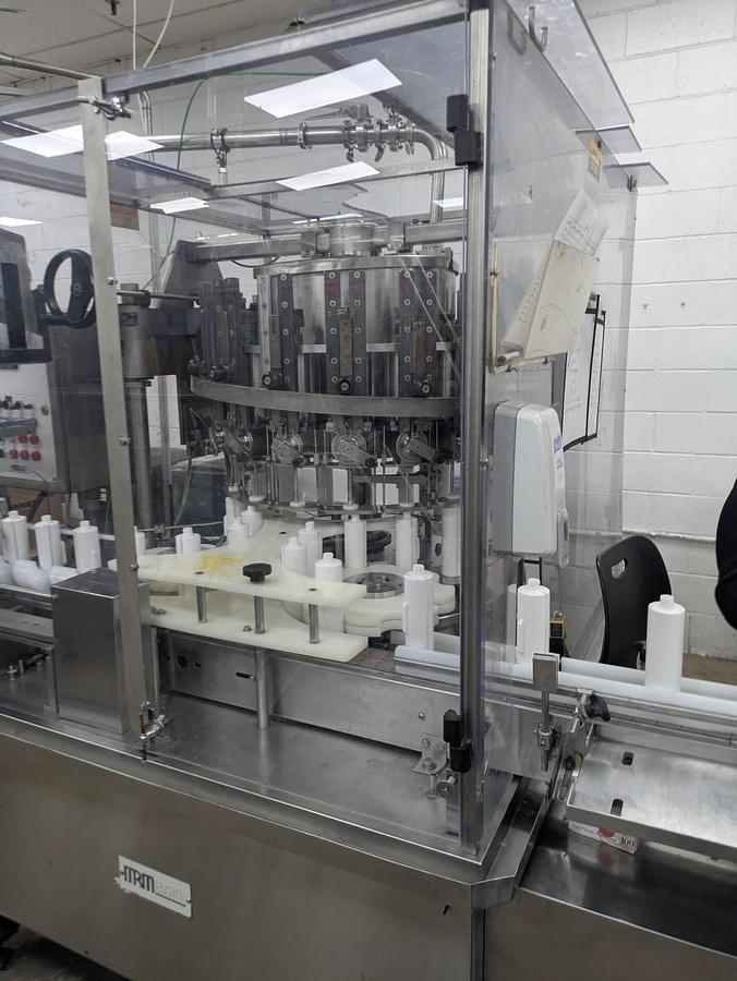 Used MRM/Elgin 16 Head Rotary Piston Filler, up to 32 Oz.