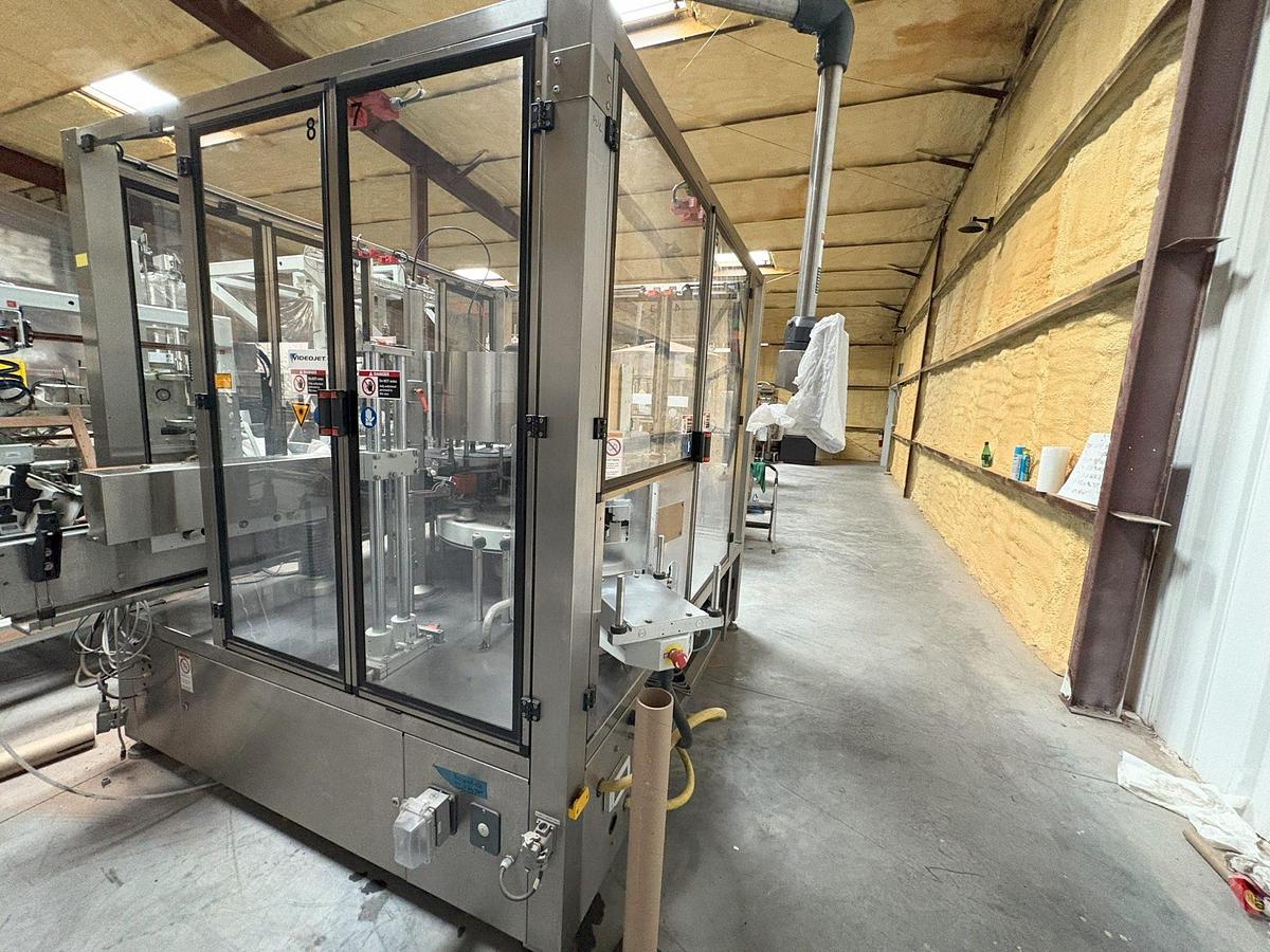 Used Kosme Nine Station Rotary Front, Back and Neck Cold Glue Labeling System