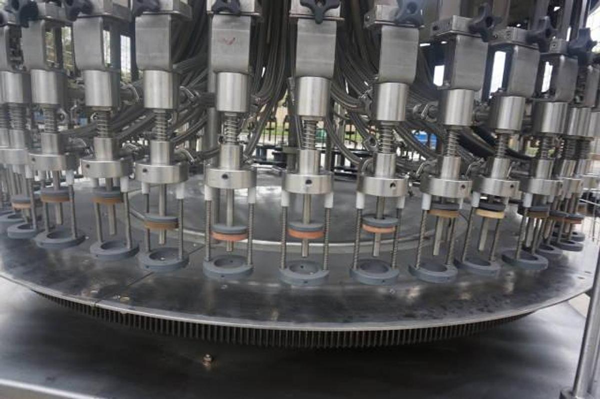 Used U.S. Bottlers 48 Valve Rotary Gravity Filling Machine, Last Filling Alcohol