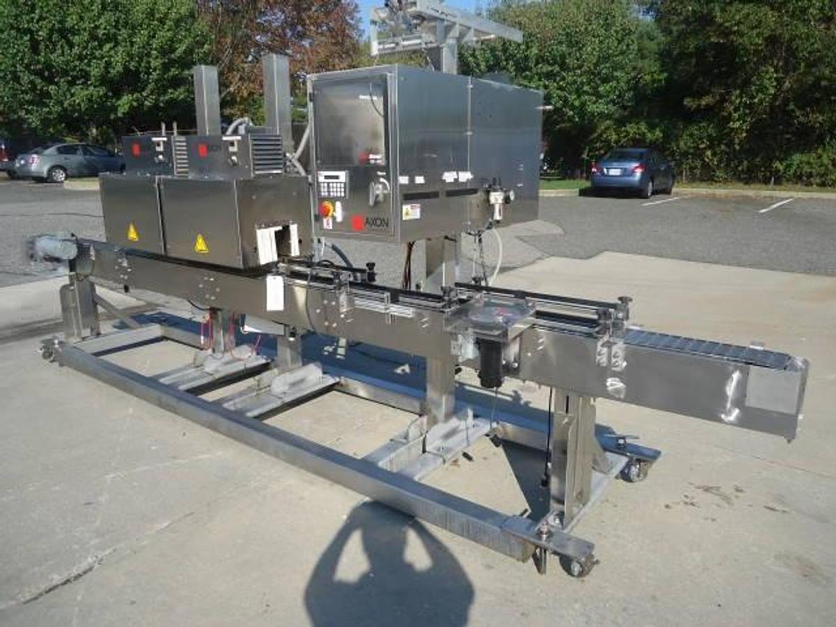 Used Axon Ez-130 Sleeving System With Twin Shrink Tunnels, 15 Ft. Conveyor