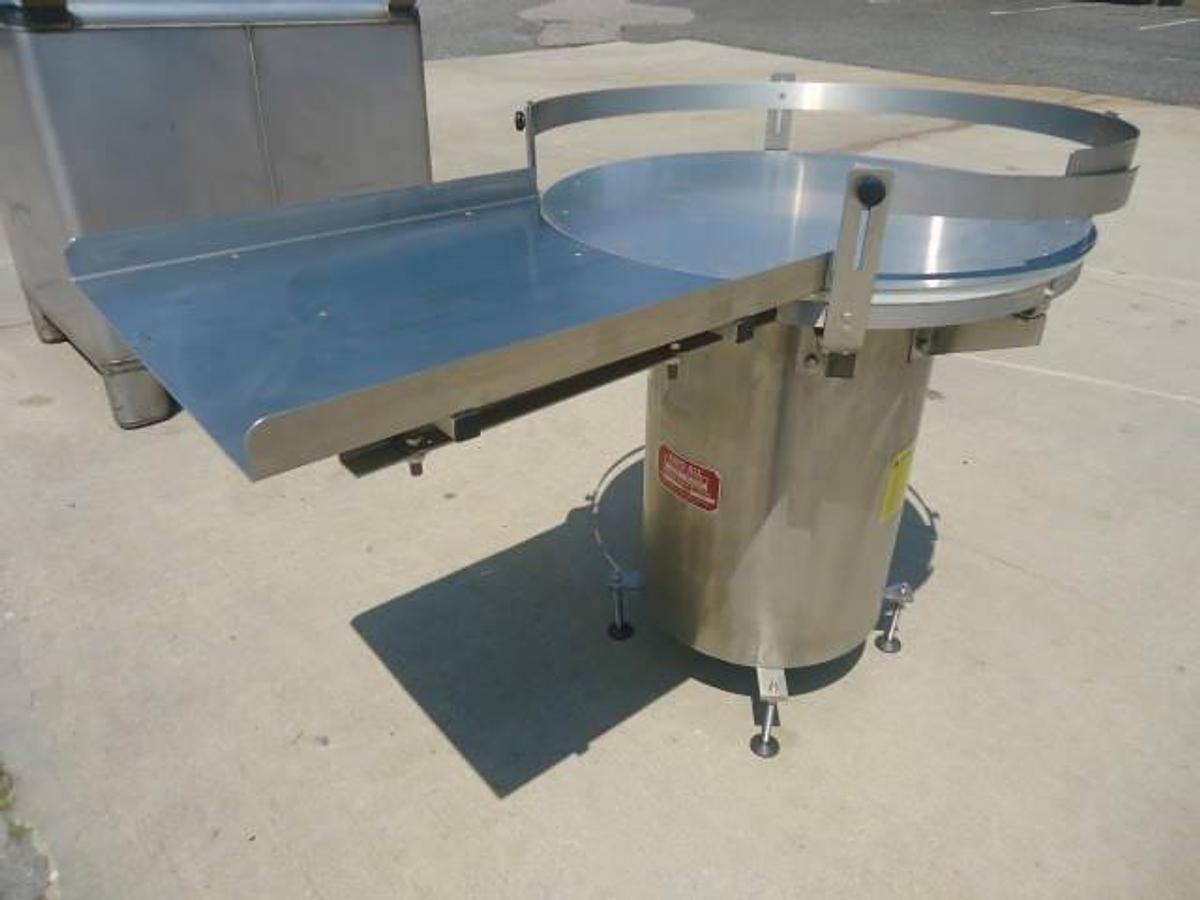 Used 36 Inch diameter Kaps All rotary unscrambling table, stainless steel base