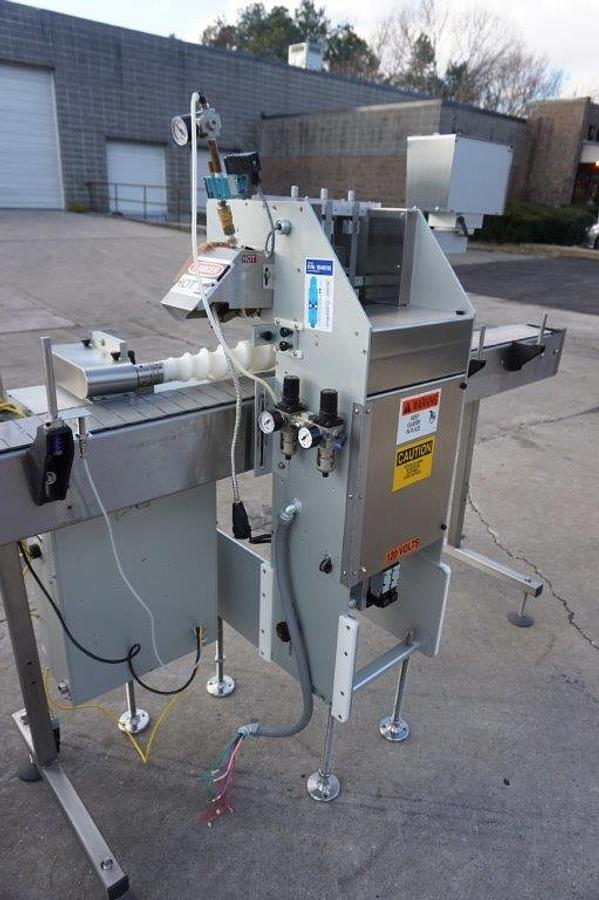 Used Creative Automation 401 Outserter, with Nordson Gluer