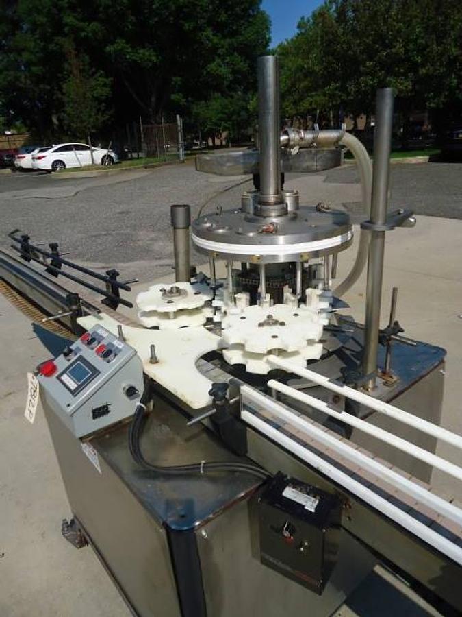 Used MRM Versafil Twelve Spout Rotary Positive Displacement Filler With Conveyor