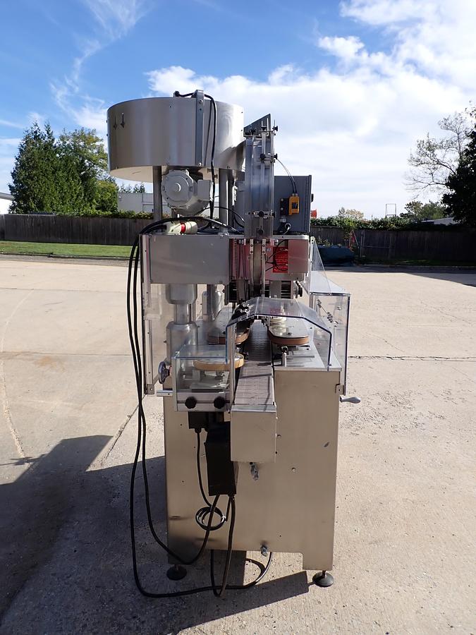 Used Kaps-All Model C Automatic Eight Spindle Capper, 200 Per Minute