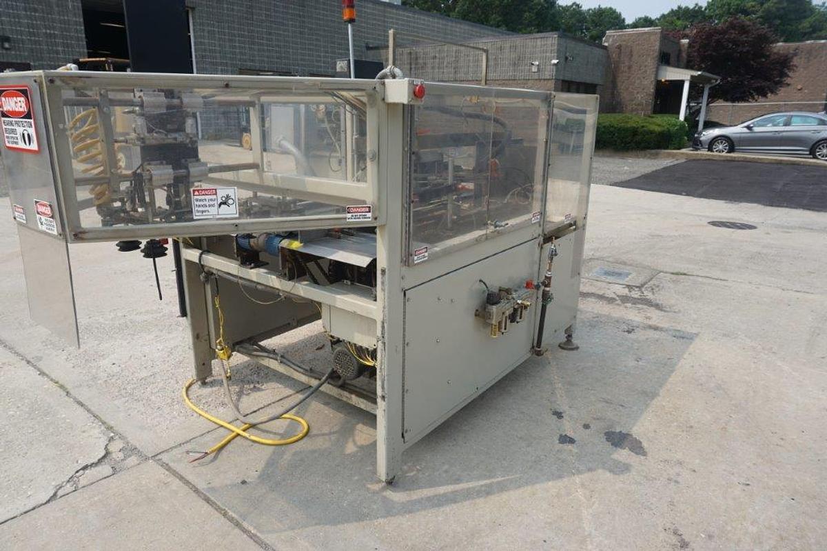 Used Packo-Matic Case Packaging Machine, Nordson Gluing