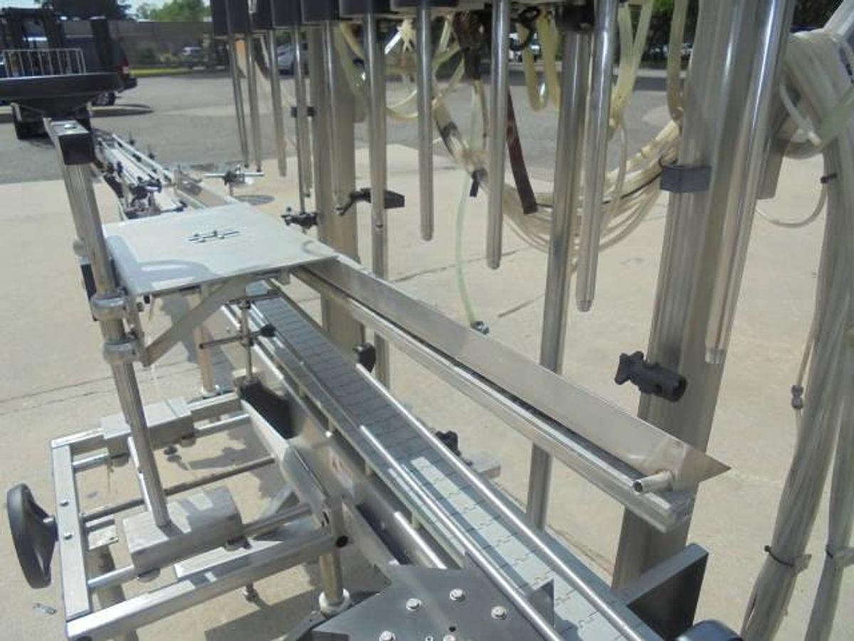 Used Fluid Packaging Solutions 10 Spout SS Gravity Liquid Filler, “Bottom Up” Fill
