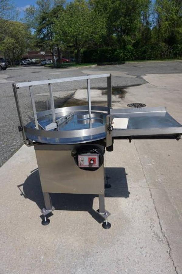 Used 36 In. Kaps-All Stainless Steel Rotary Table, with unscrambling shelf
