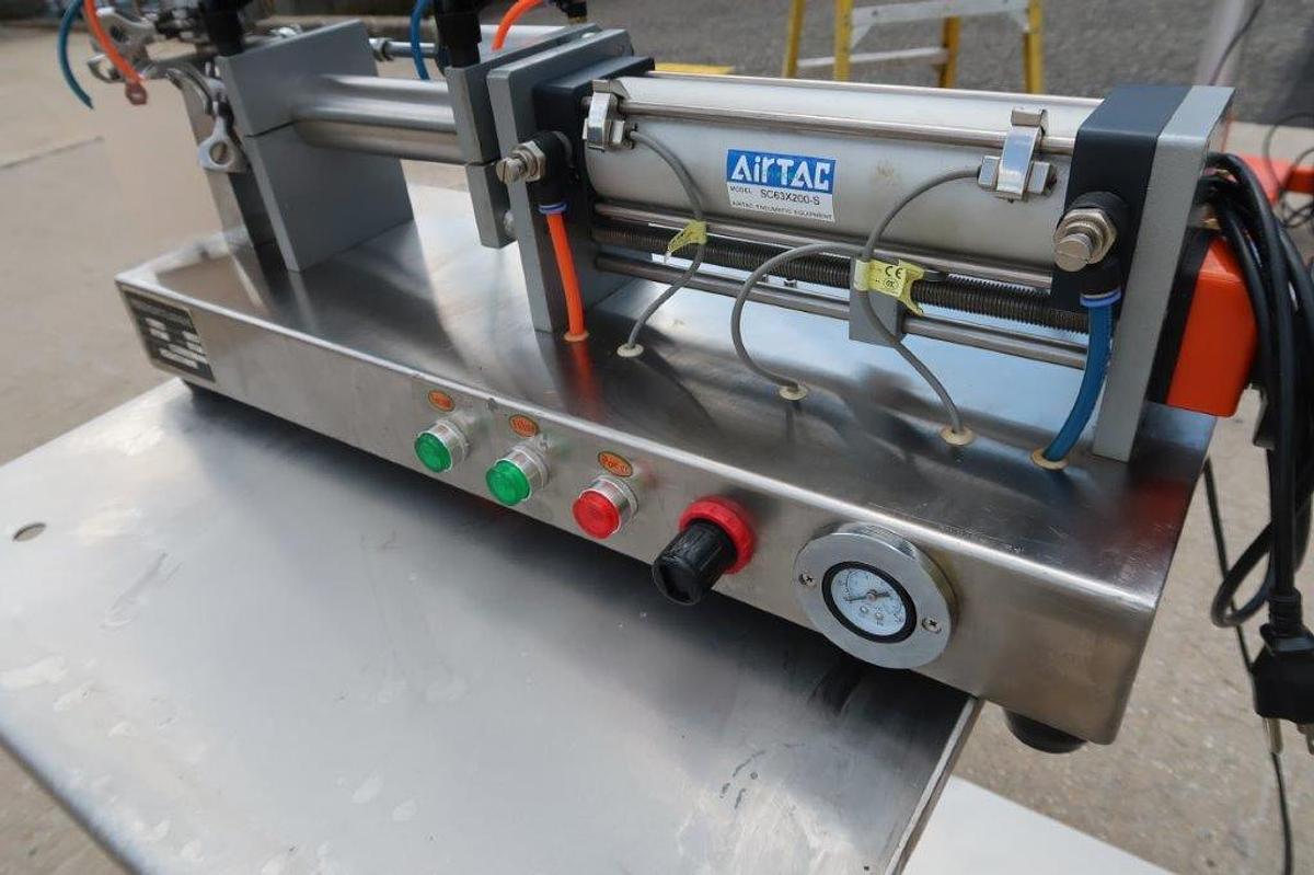 Used GPTG Tabletop Air Operated Semi-Automatic Piston Filler, 250mL Maximum Fill