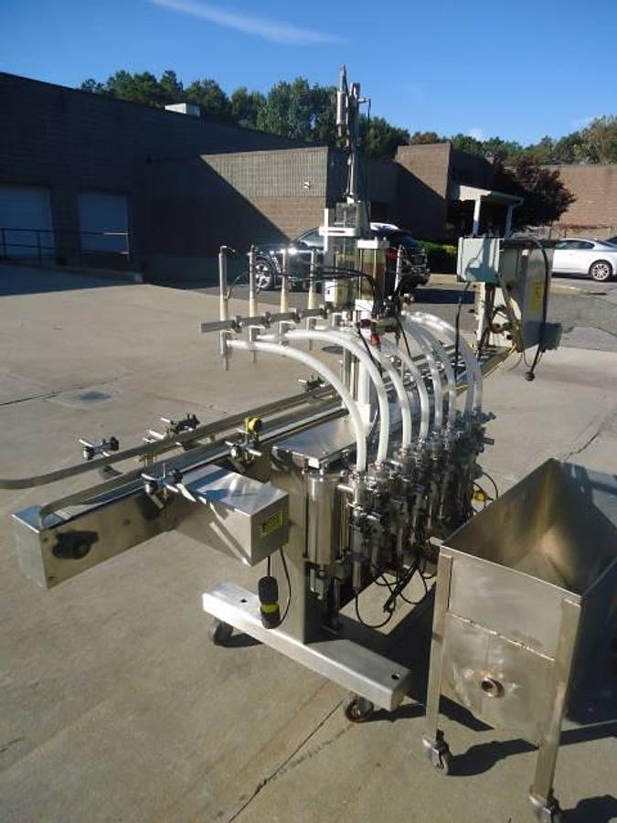 Used Kaps-All/Fills-All 8 Piston Automatic Filler, With Conveyor