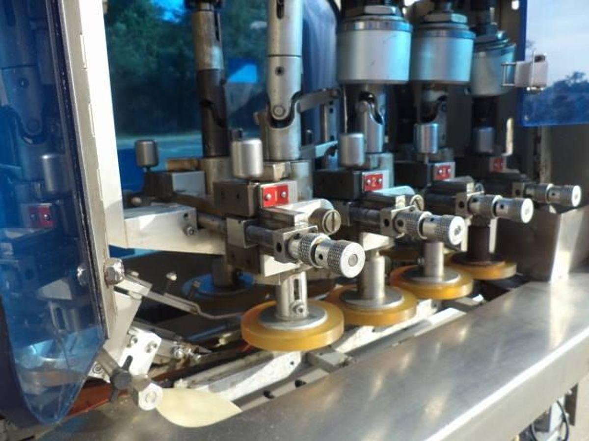 Used Pack West eight spindle inline automatic capper