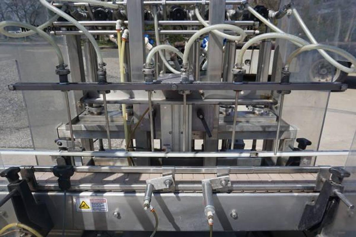 Used Biner Ellison Six Head Straight Line Piston Filling Machine