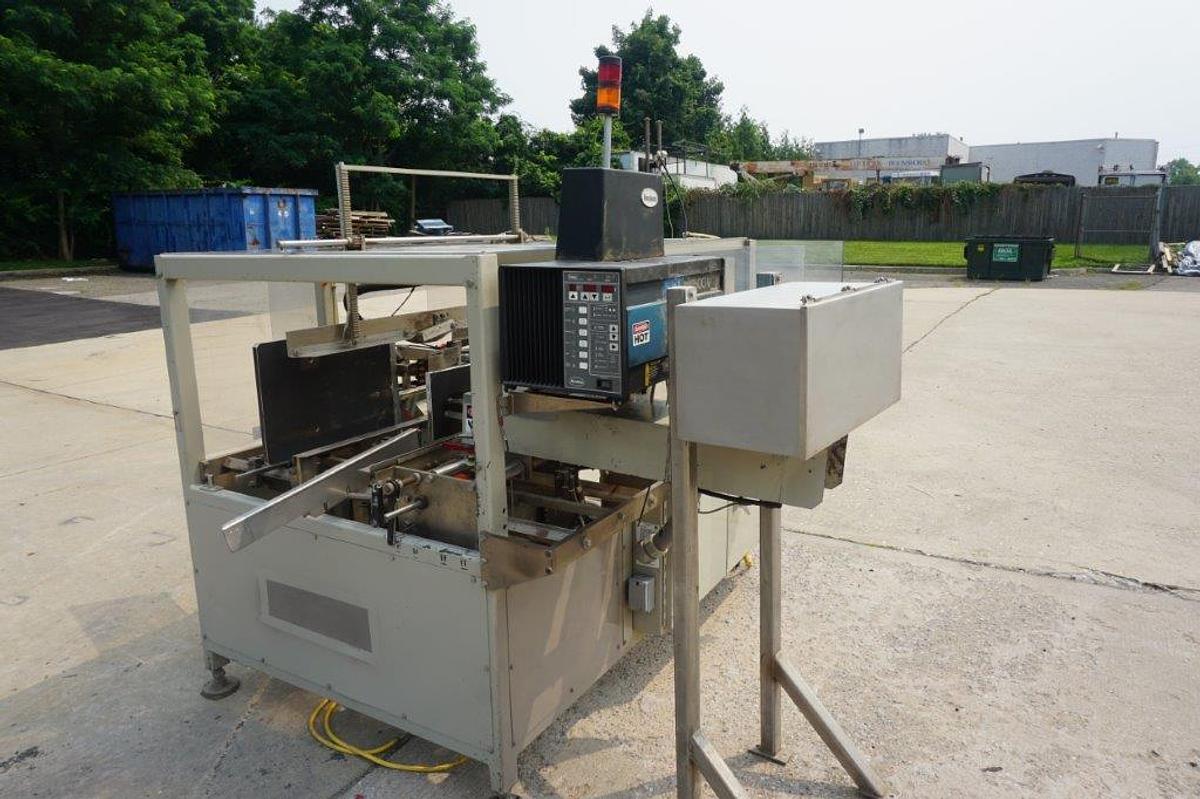 Used Packo-Matic Case Packaging Machine, Nordson Gluing