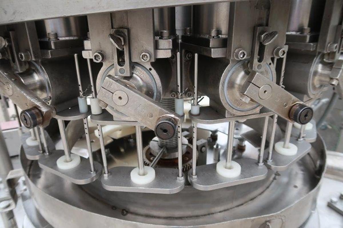 Used MRM/Elgin 16 Head Rotary Piston Filler, up to 32 Oz.