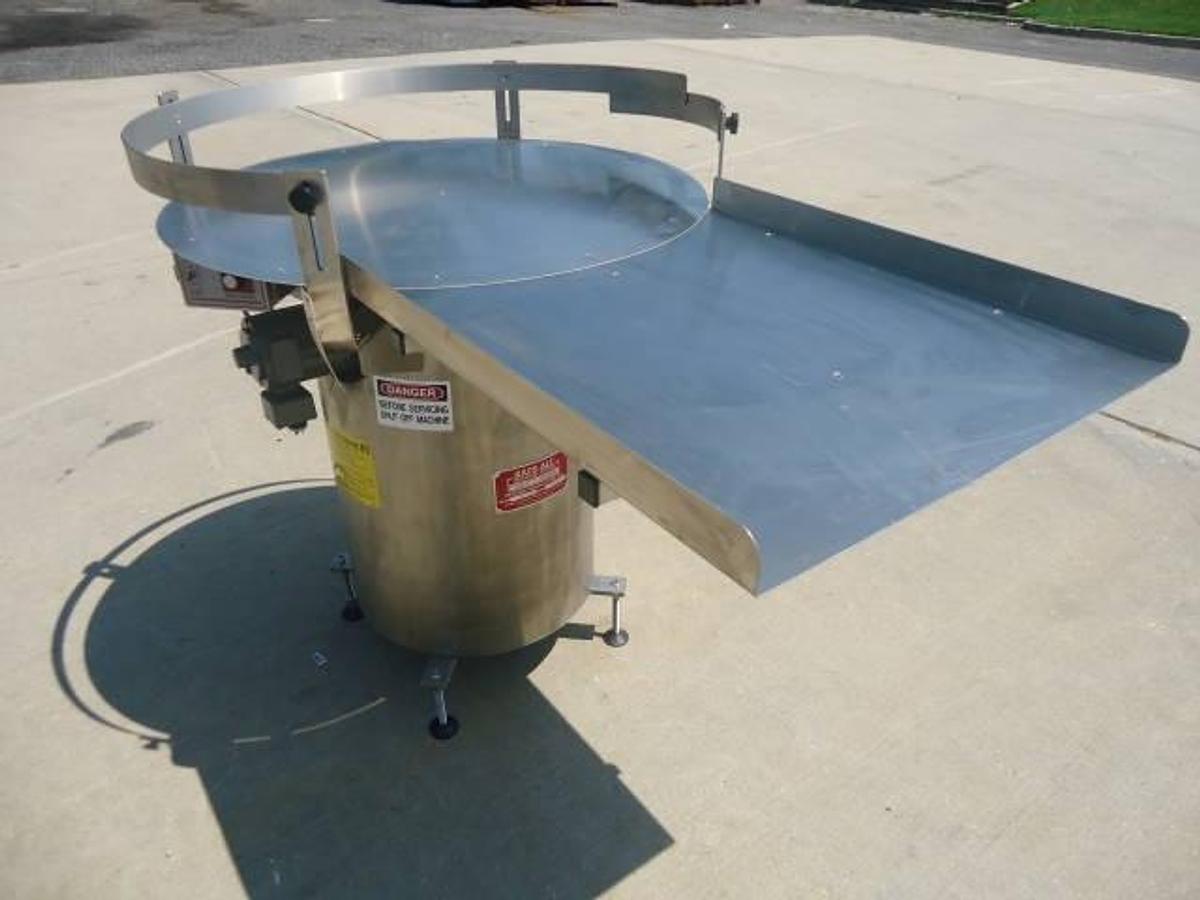 Used 36 Inch diameter Kaps All rotary unscrambling table, stainless steel base