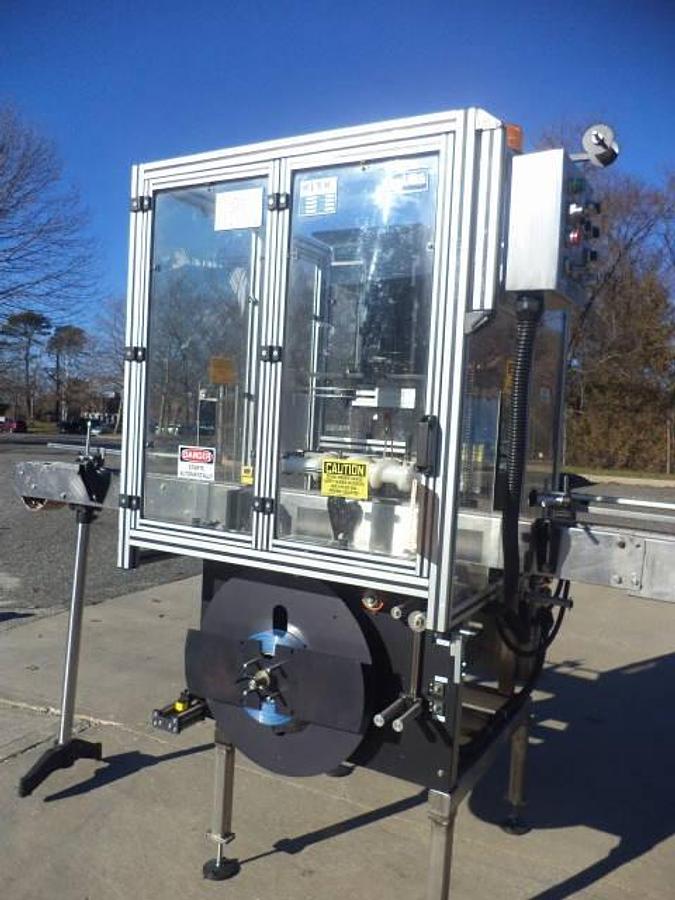 Used PDC 65-M Tamper Evident Neck Bander/Sleever, 200 pm