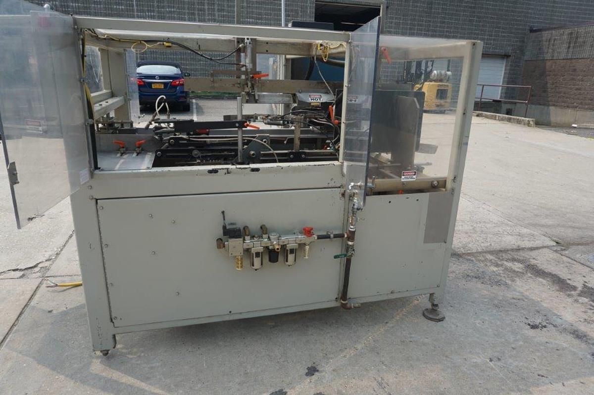 Used Packo-Matic Case Packaging Machine, Nordson Gluing