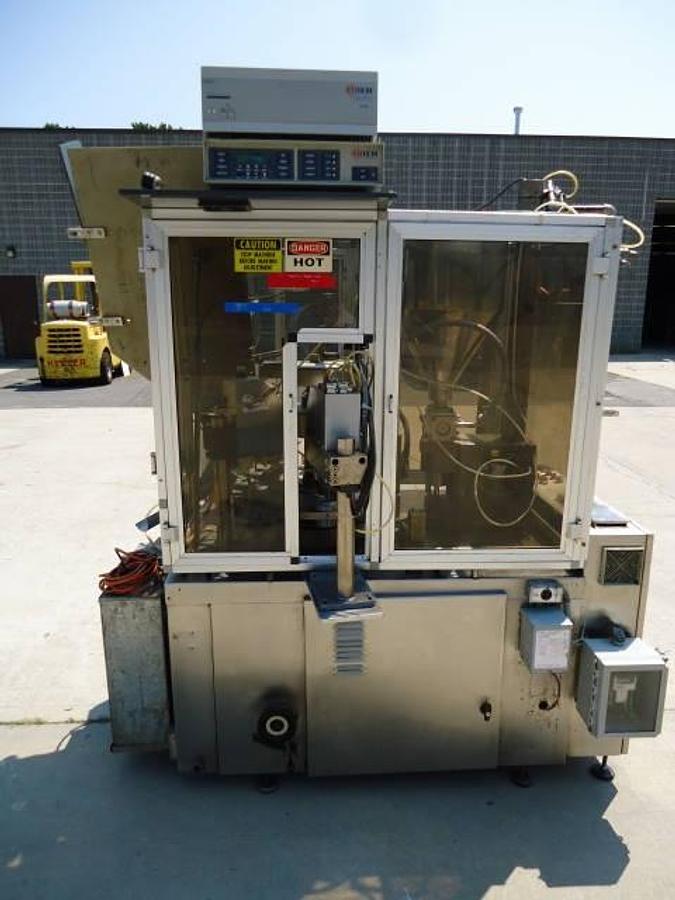 Used Comadis C100 automatic tube filler/sealer, high frequency sealing