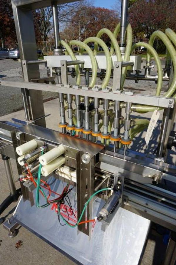 Used Accutek 8 Head Automatic Pressure Overflow Liquid Filling Machine, with Conveyor