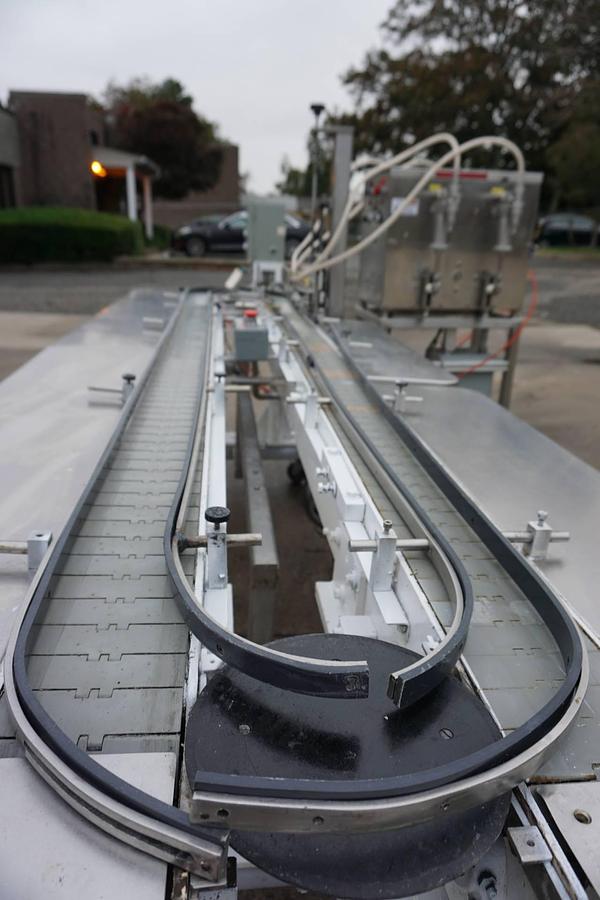 Used Filling Equipment Company Four Head Piston Filler with Carousel Conveyor