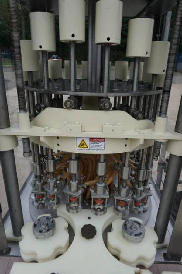 Used 18 Head Rotary Pressure Gravity Liquid Filling Machine
