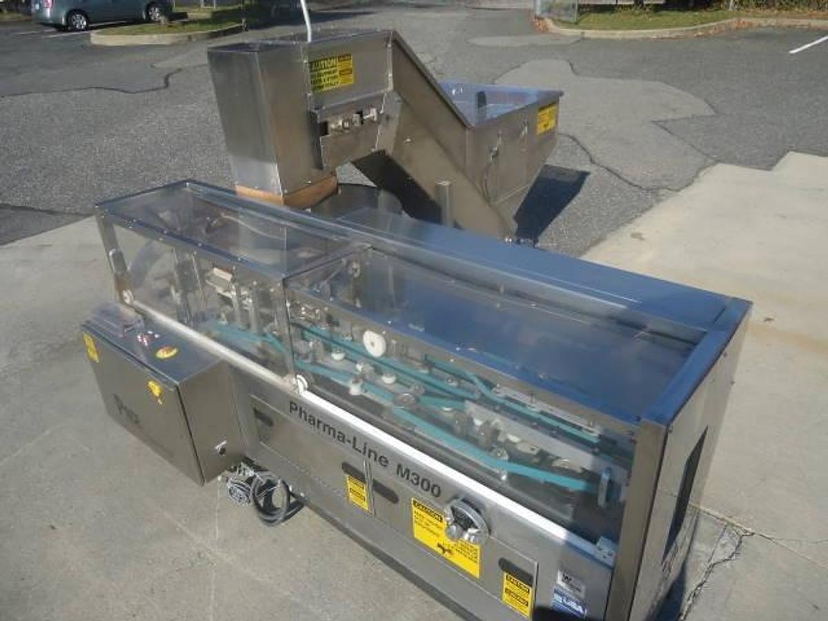 Used PACE PHARMA-LINE M300 STAINLESS STEEL PLASTIC BOTTLE UNSCRAMBLER WITH ELEVATOR