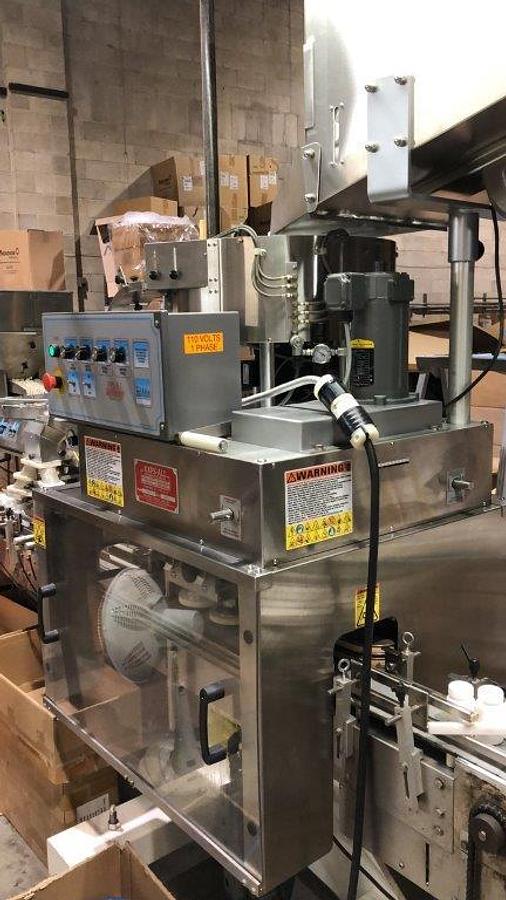 Used Kaps-All E-4 Four Spindle Capper With Conveyor