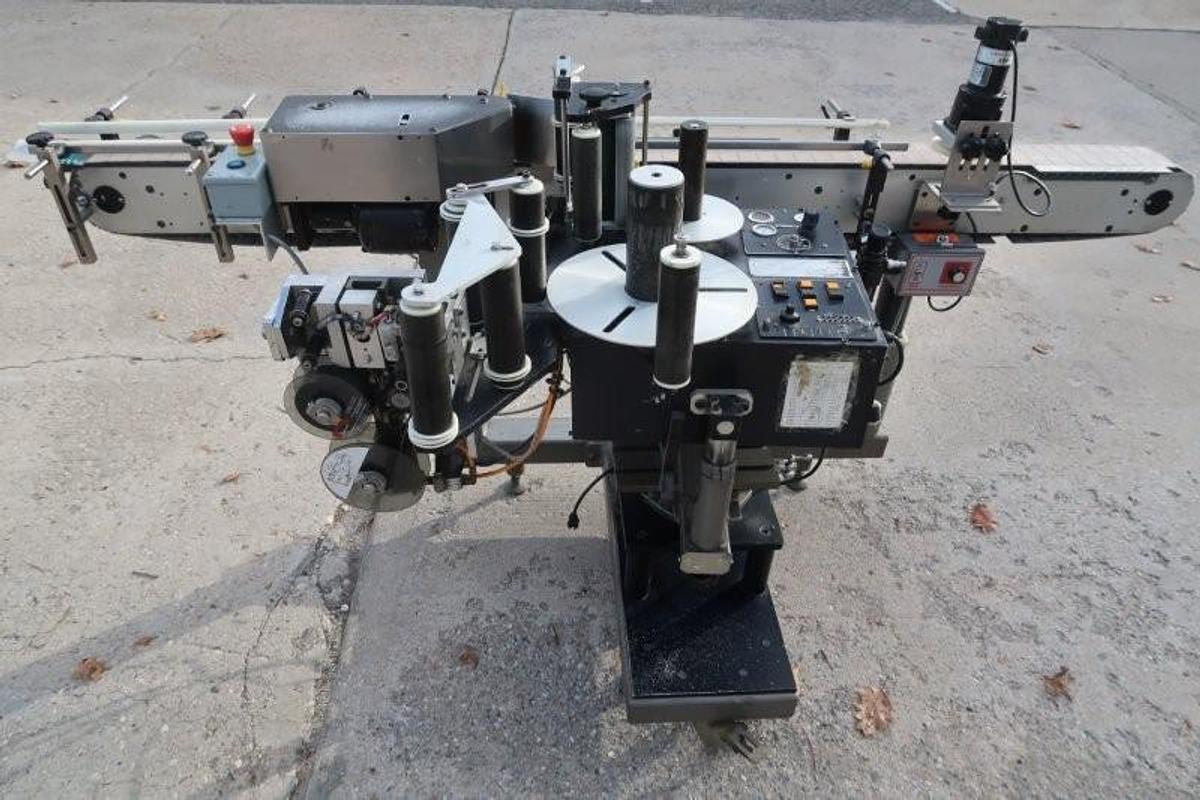 Used LSI Auto Pressure Sensitive Wraparound Labeler with Coder