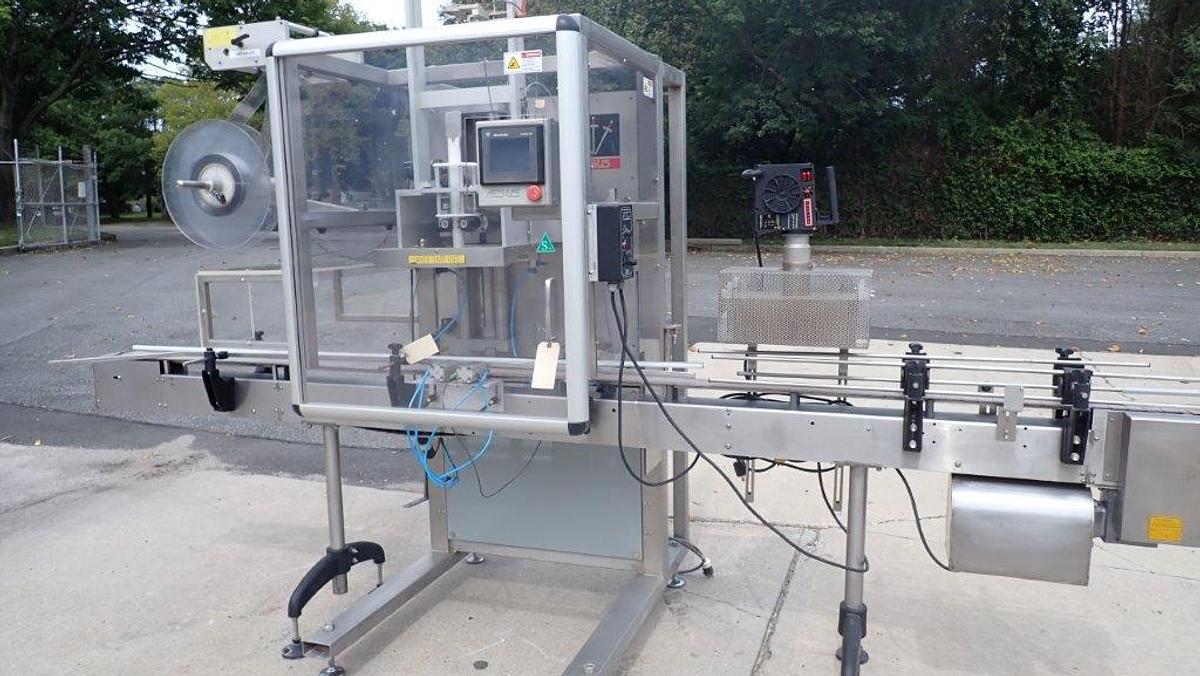 Used Aesus “Delta” High-Speed Neck Bander with Shrink Tunnel