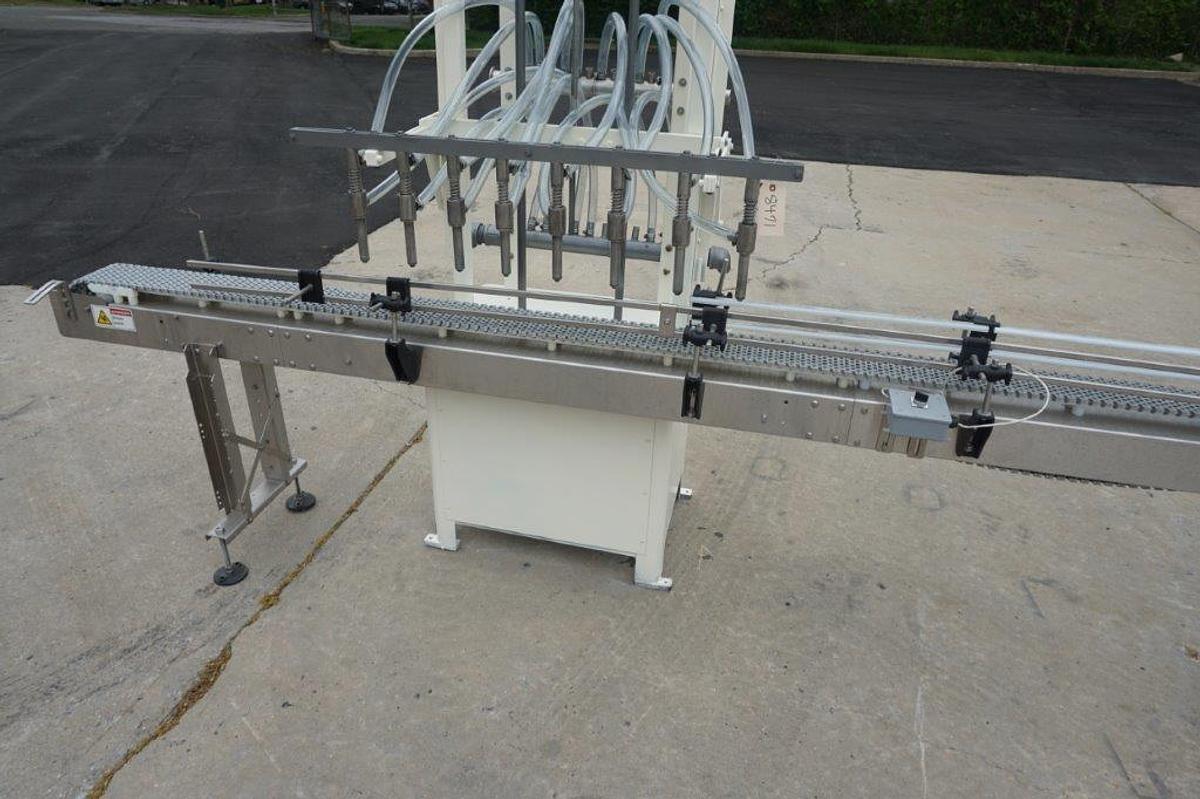 Used RJM 8 Spout Straight Line Liquid Filling Machine, Pressure Gravity Nozzles