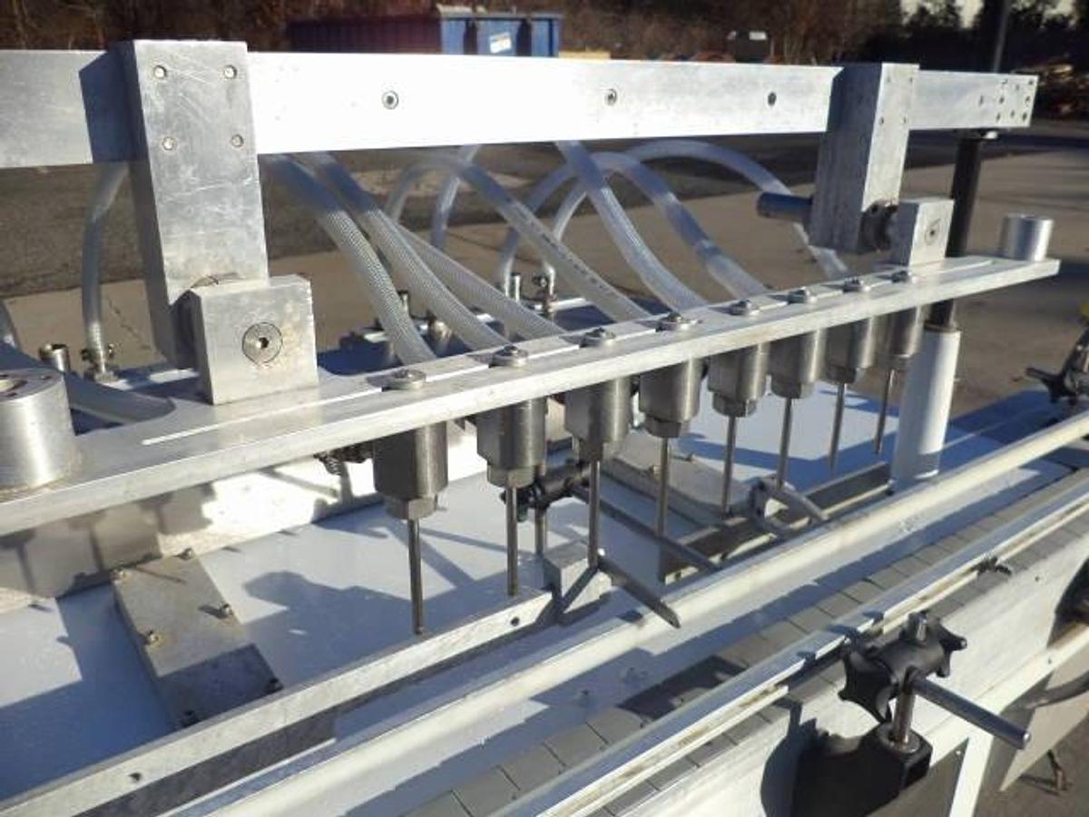 Used Cozzoli Eight Piston Straight Line Automatic Filing Machine, 240cc Pistons