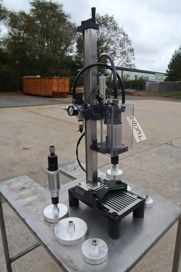 Used Kinex Air Operated Chuck Style Capper with Bench Top Table
