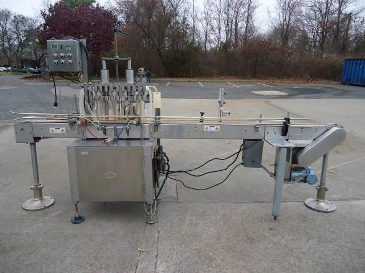 Used Jg Machine Works Twelve Spout Automatic Pressure Gravity Filler