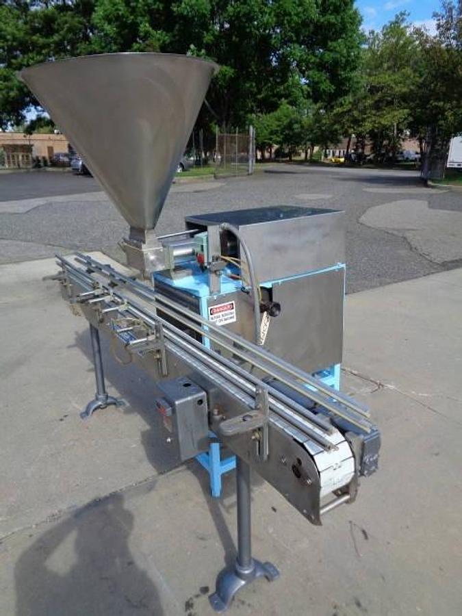 Used Simplex Twin Head Automatic Piston Filler With Indexing Conveyor