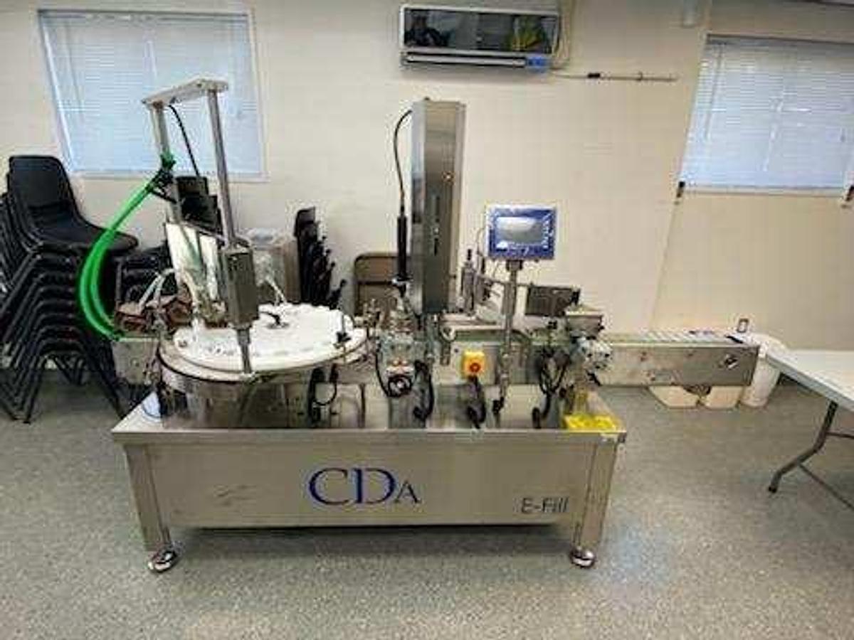 Used CDA Bottling Line with Rotary Tables