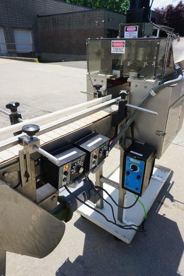 Used Universal Four (4) Spindle Cap Tightener/Retorquer, With Conveyor