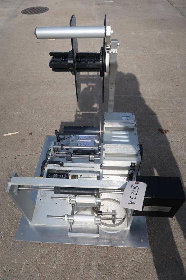 Used Universal R-310 Tabletop Semi-Automatic Pressure Sensitive Spot/Wraparound Labeler