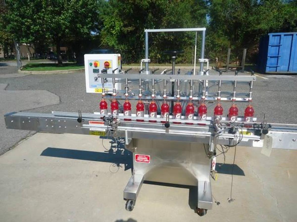 Used Kaps-All Twelve Spout Inline Pressure Filler Model Fa-P