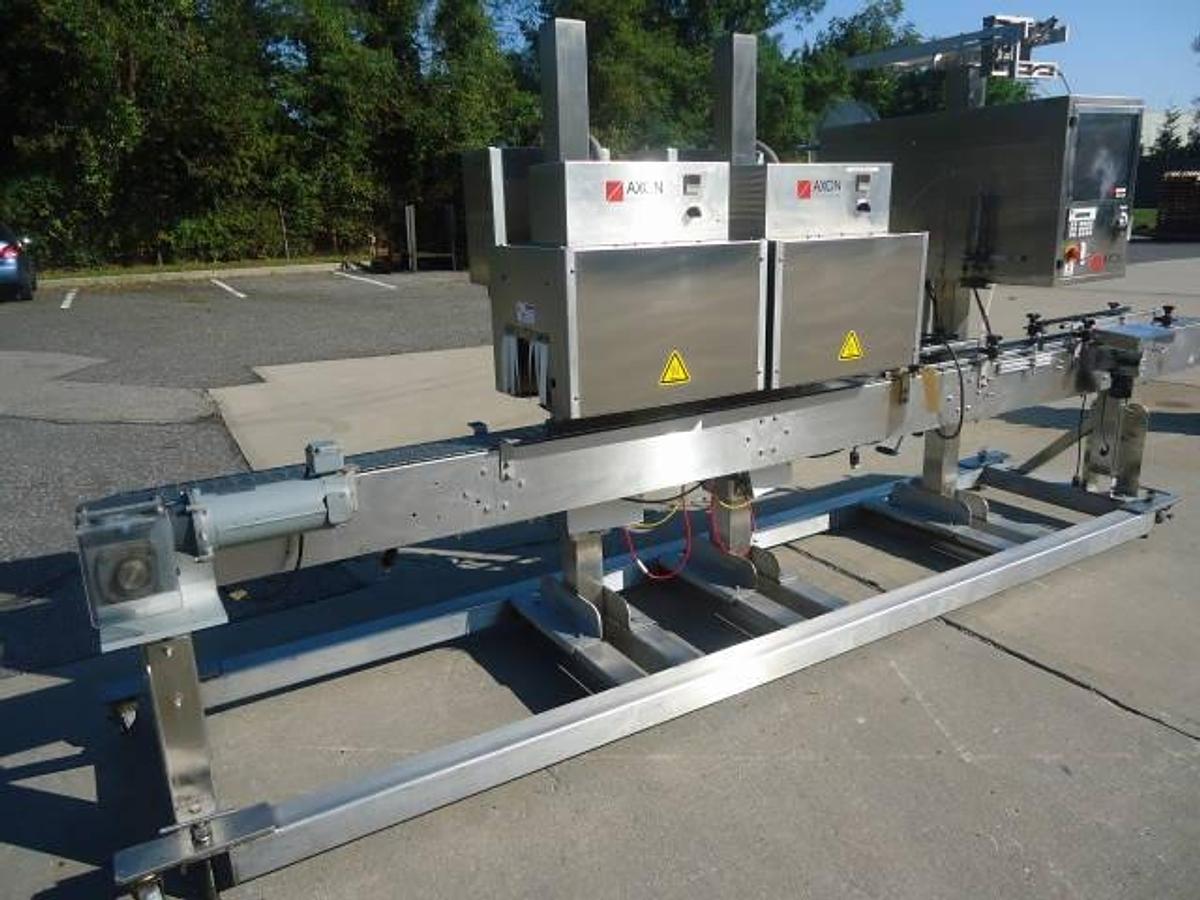 Used Axon Ez-130 Sleeving System With Twin Shrink Tunnels, 15 Ft. Conveyor