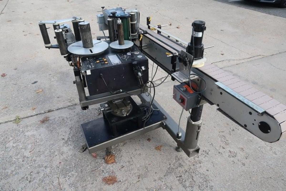Used LSI Auto Pressure Sensitive Wraparound Labeler with Coder