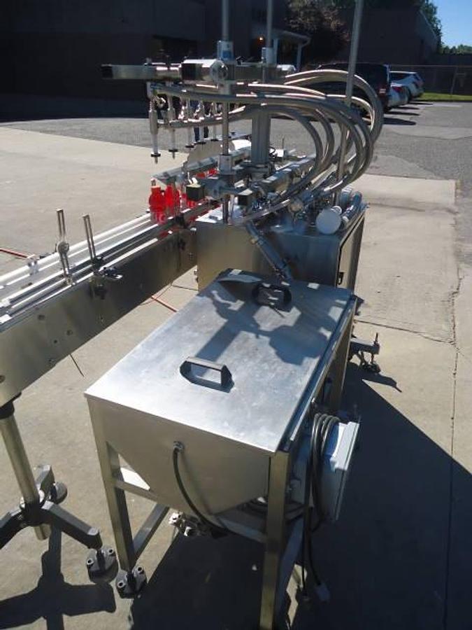Used Inline Filling Systems Six Head Level Head Overflow Pressure Filler With 20 Ft. Conveyor