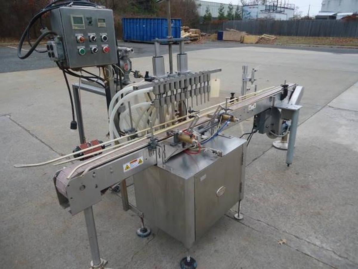 Used Jg Machine Works Twelve Spout Automatic Pressure Gravity Filler
