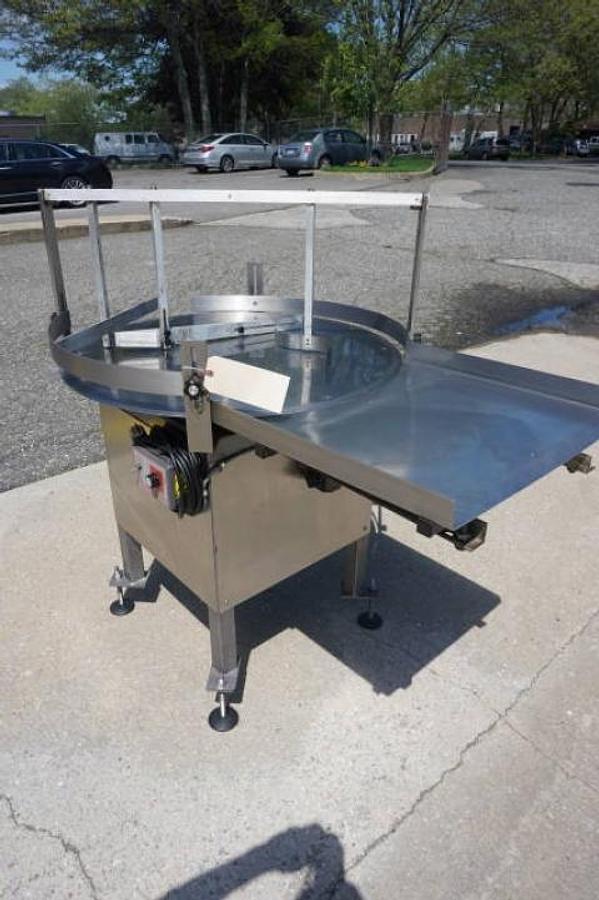 Used 36 In. Kaps-All Stainless Steel Rotary Table, with unscrambling shelf