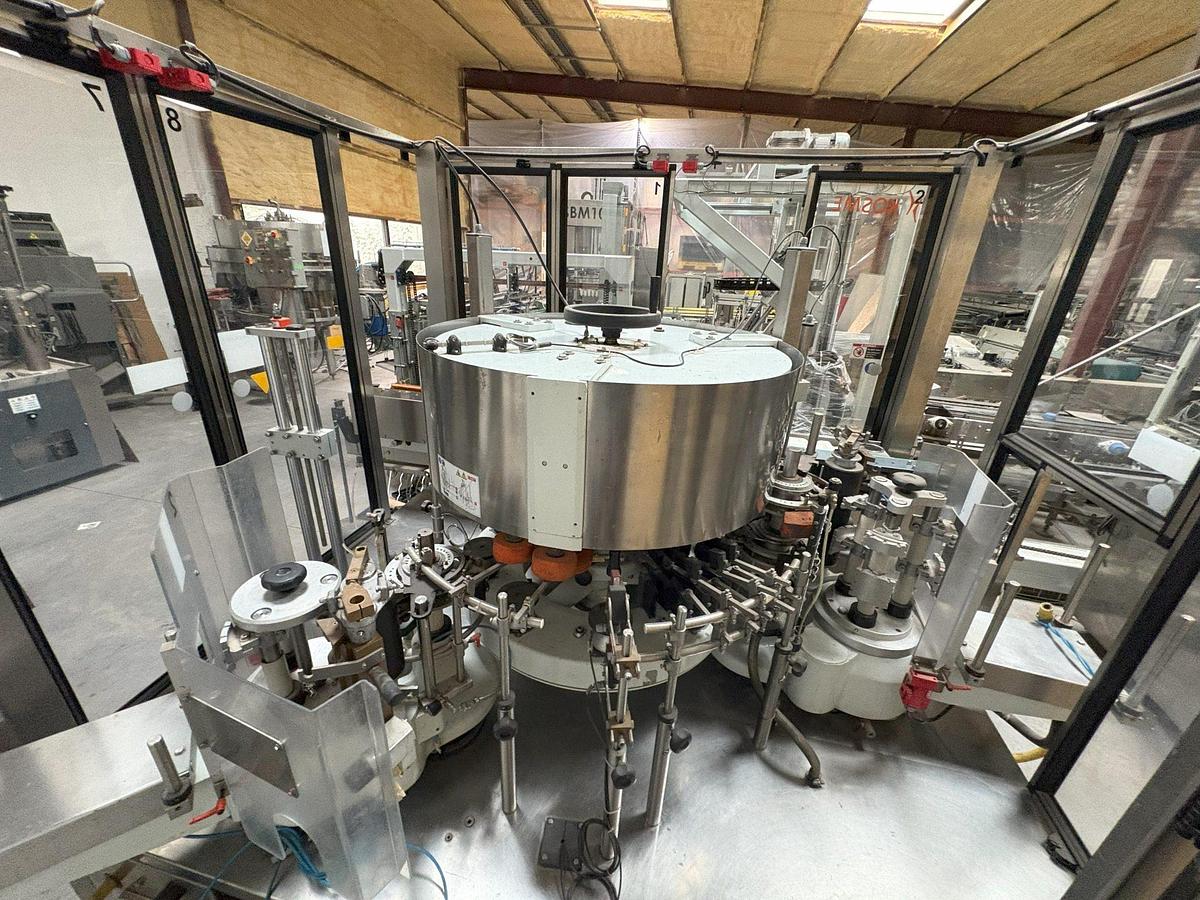 Used Kosme Nine Station Rotary Front, Back and Neck Cold Glue Labeling System