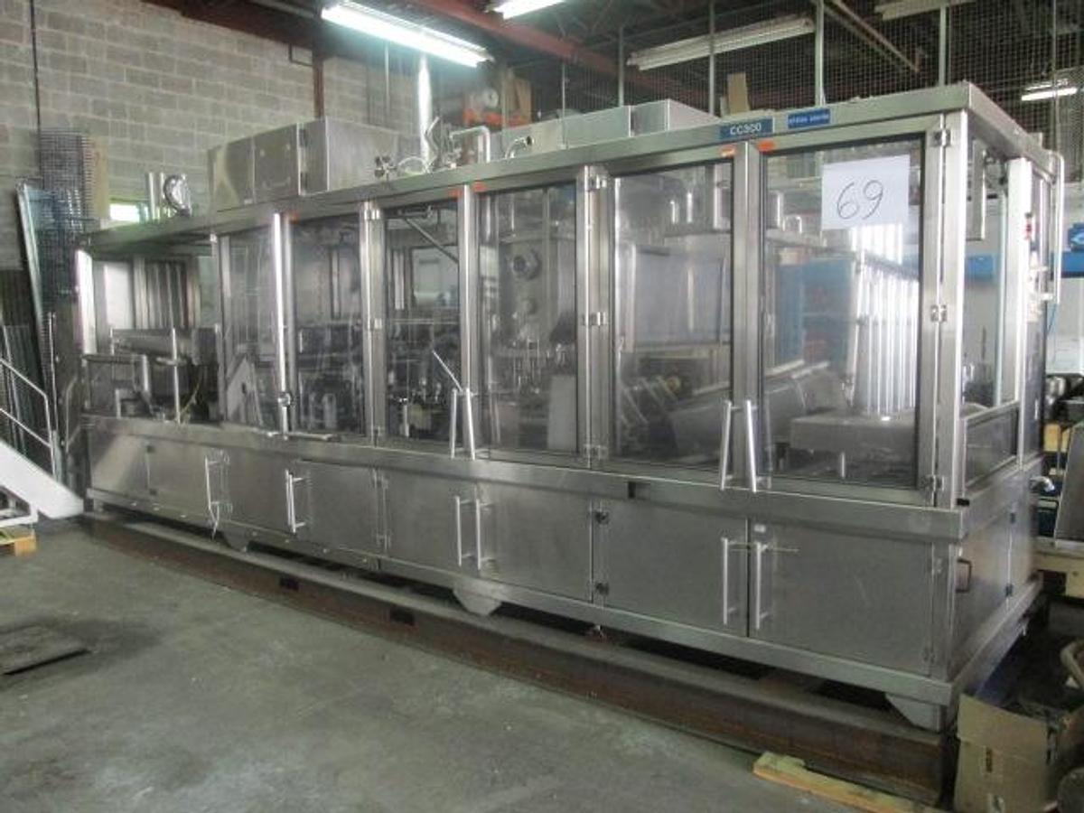 Used BWI Holmatic Opti-Fil four lane cup filling line