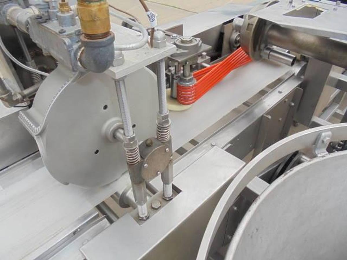 Used Colborne T-28000 Automatic Turnover Pie Machine, tooled currently for Jamaican Beef Patties
