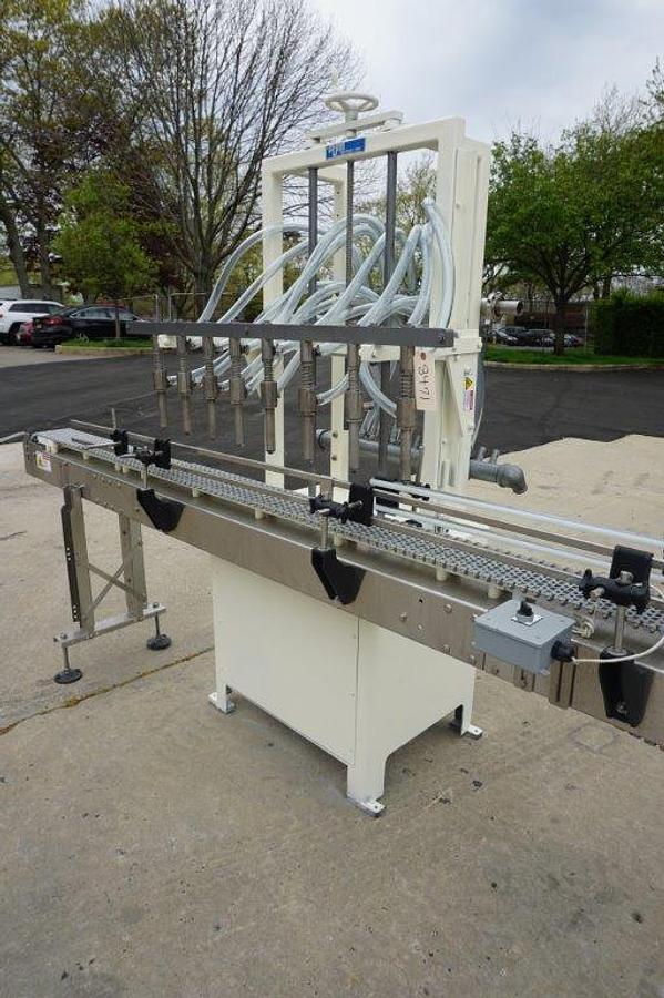 Used RJM 8 Spout Straight Line Liquid Filling Machine, Pressure Gravity Nozzles