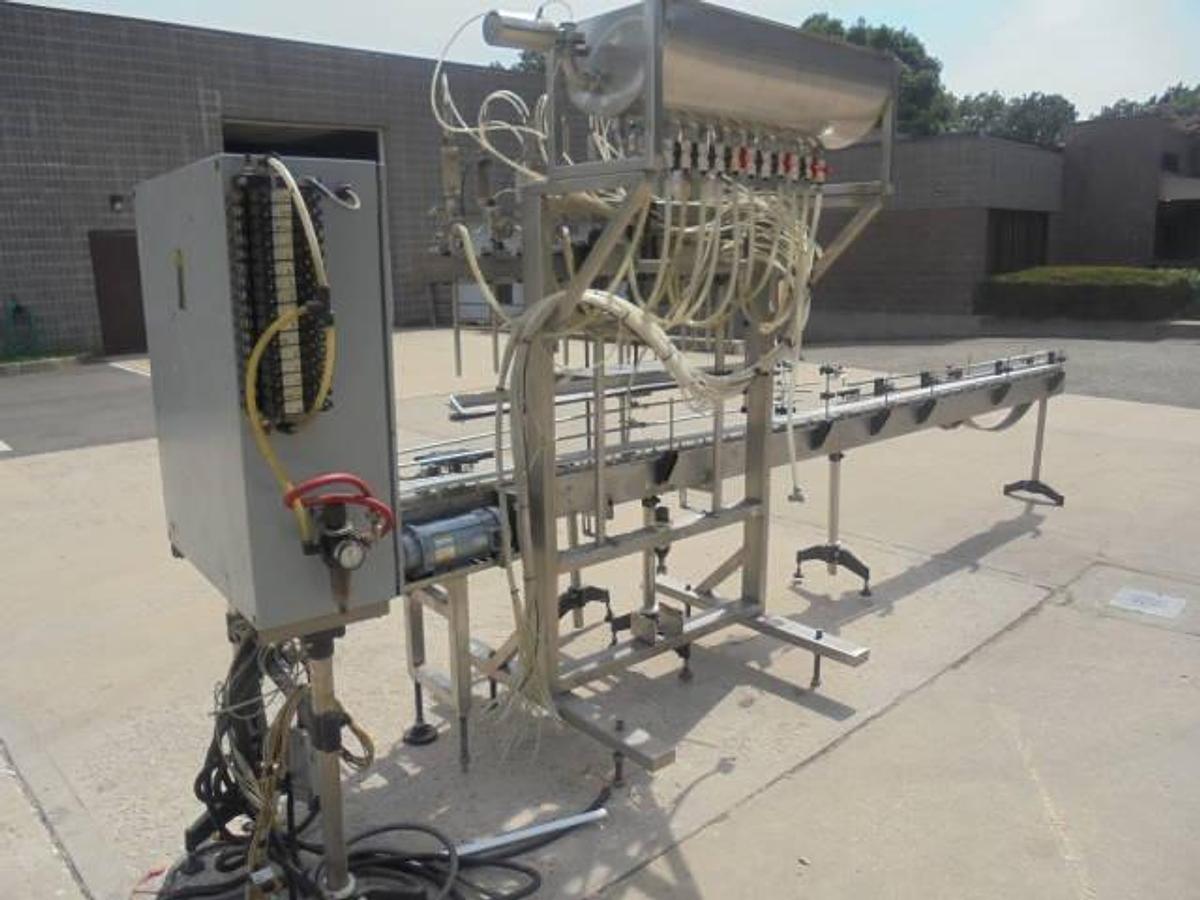 Used Fluid Packaging Solutions 10 Spout SS Gravity Liquid Filler, “Bottom Up” Fill