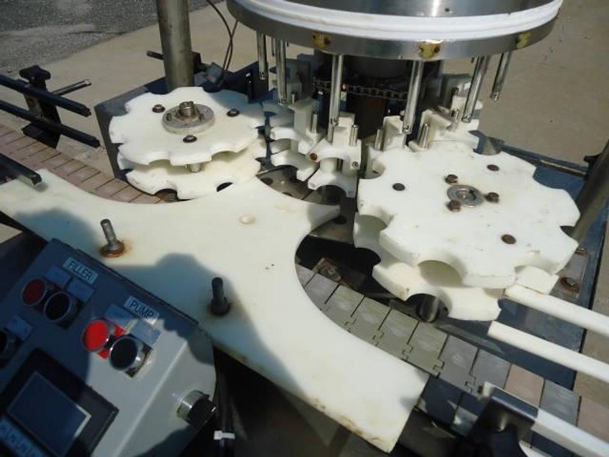 Used MRM Versafil Twelve Spout Rotary Positive Displacement Filler With Conveyor