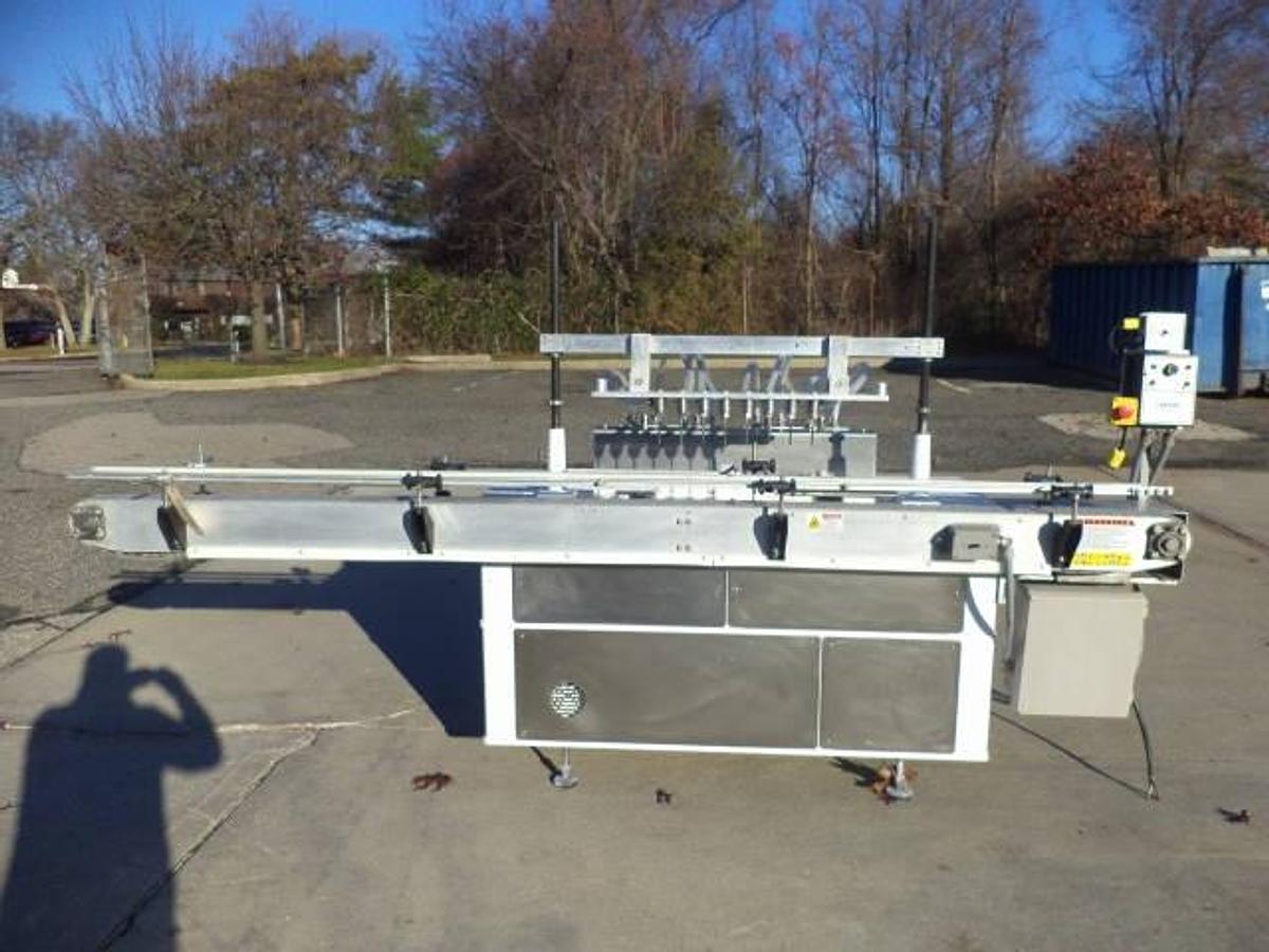 Used Cozzoli Eight Piston Straight Line Automatic Filing Machine, 240cc Pistons