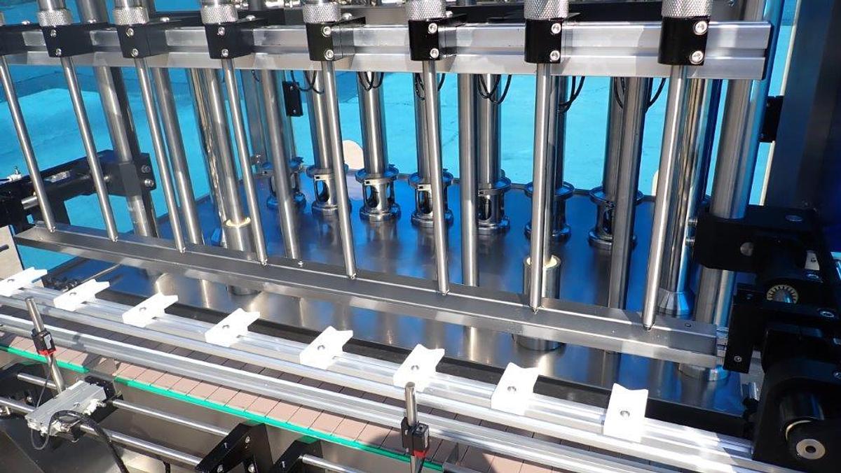 Used Metica Automatic Filling Line, up to 16 Oz. Bottles